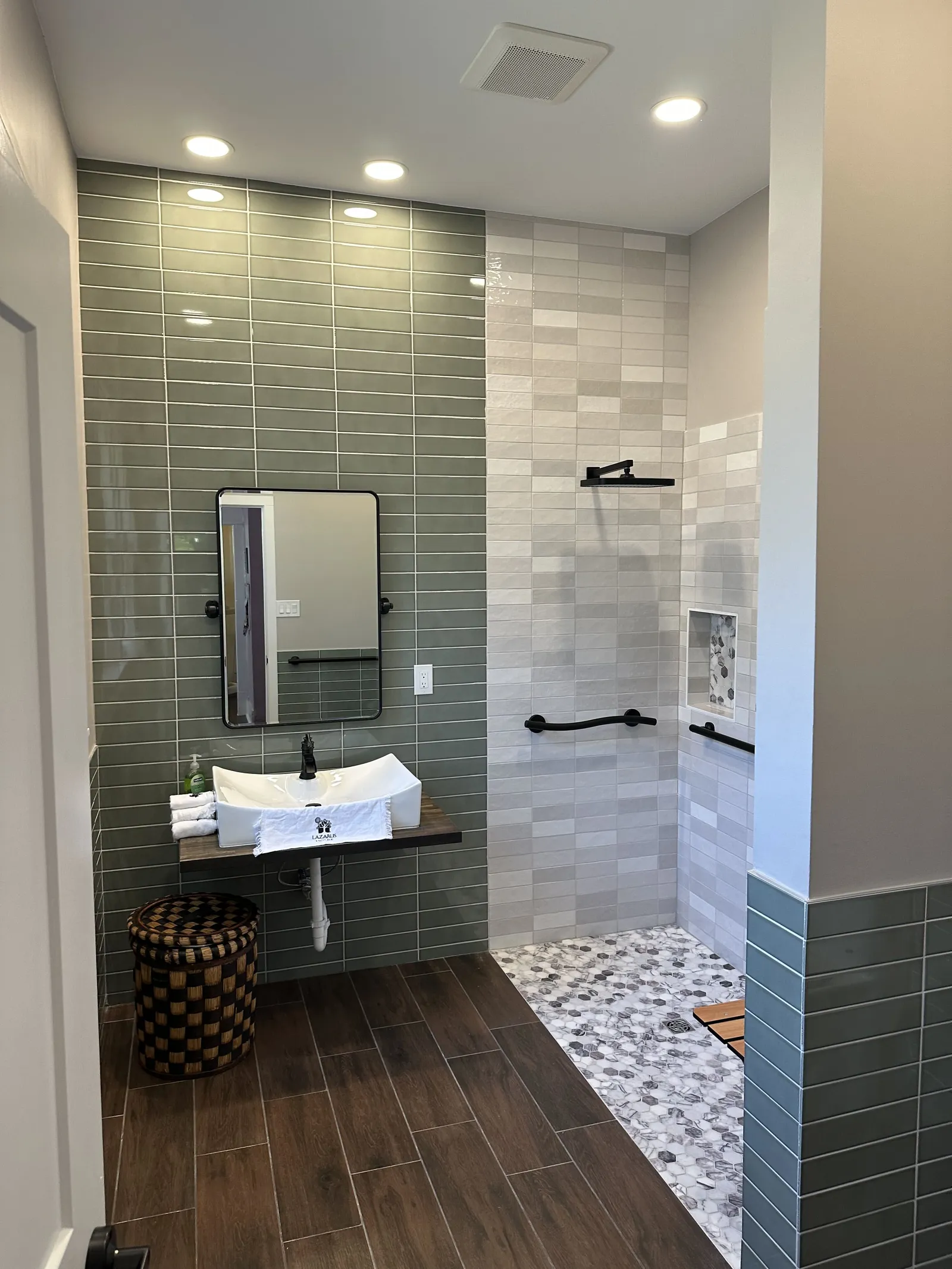 Accessible bathroom with curbless shower and floating vanity
