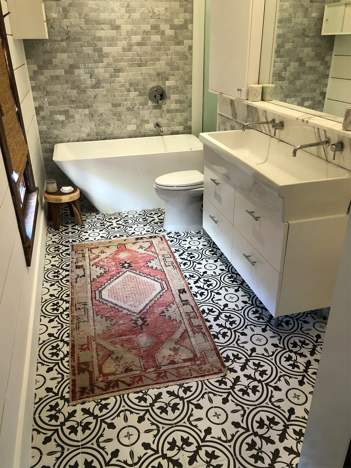 Cement tile floor and marble bath in the renovation