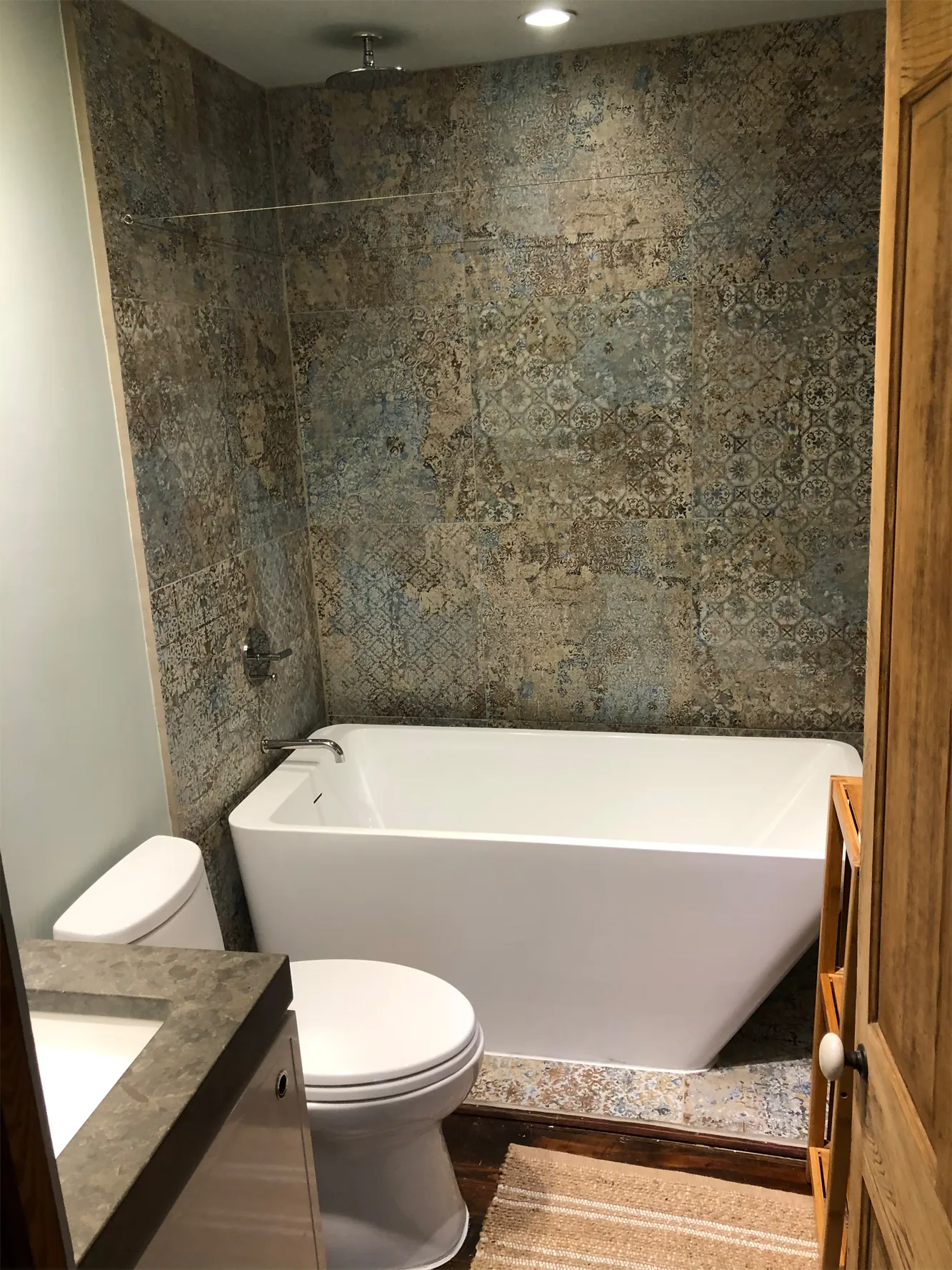Patterned tile shower in a remodeled Houston bathroom