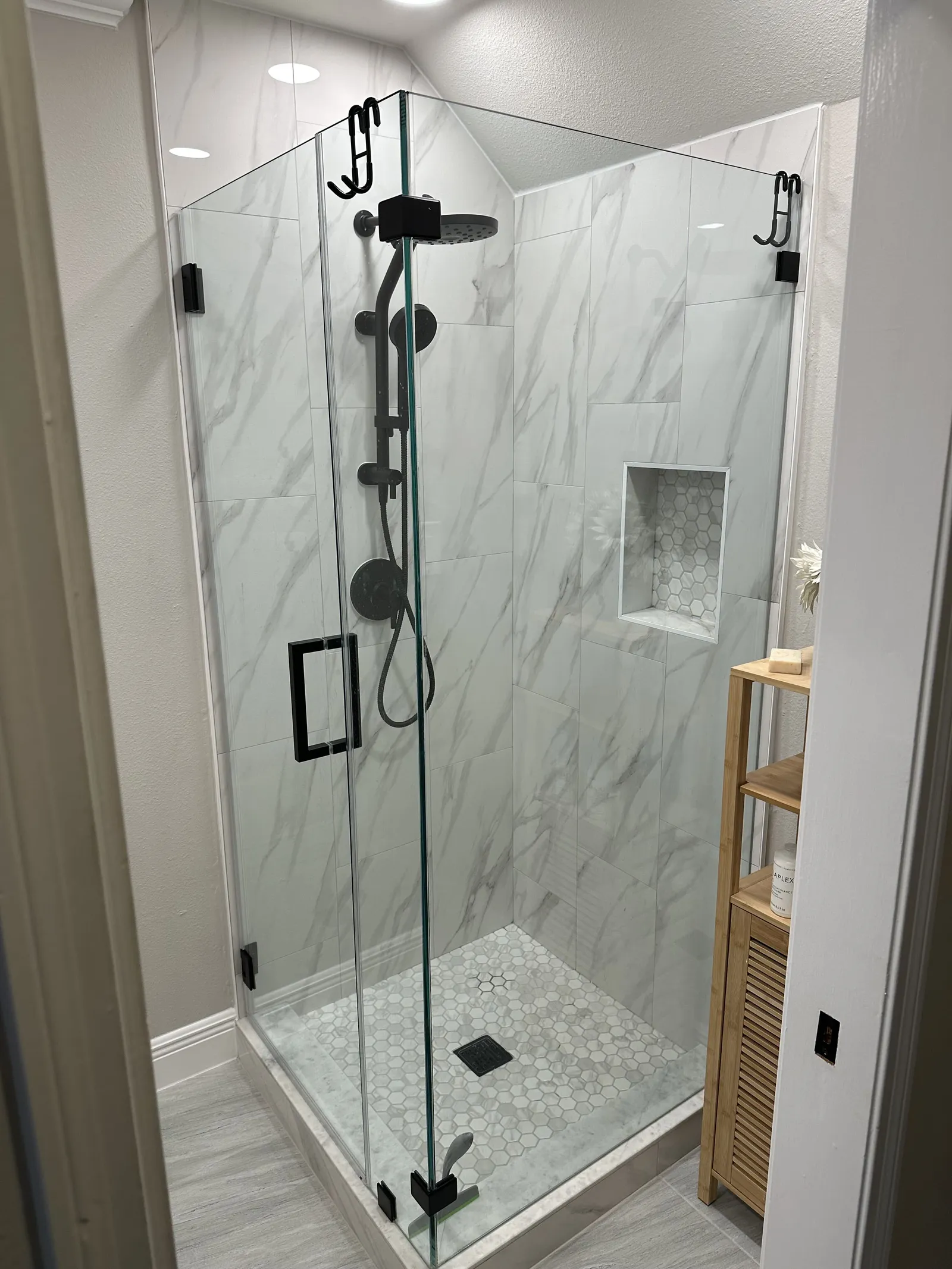 Frameless glass shower in a remodeled bath