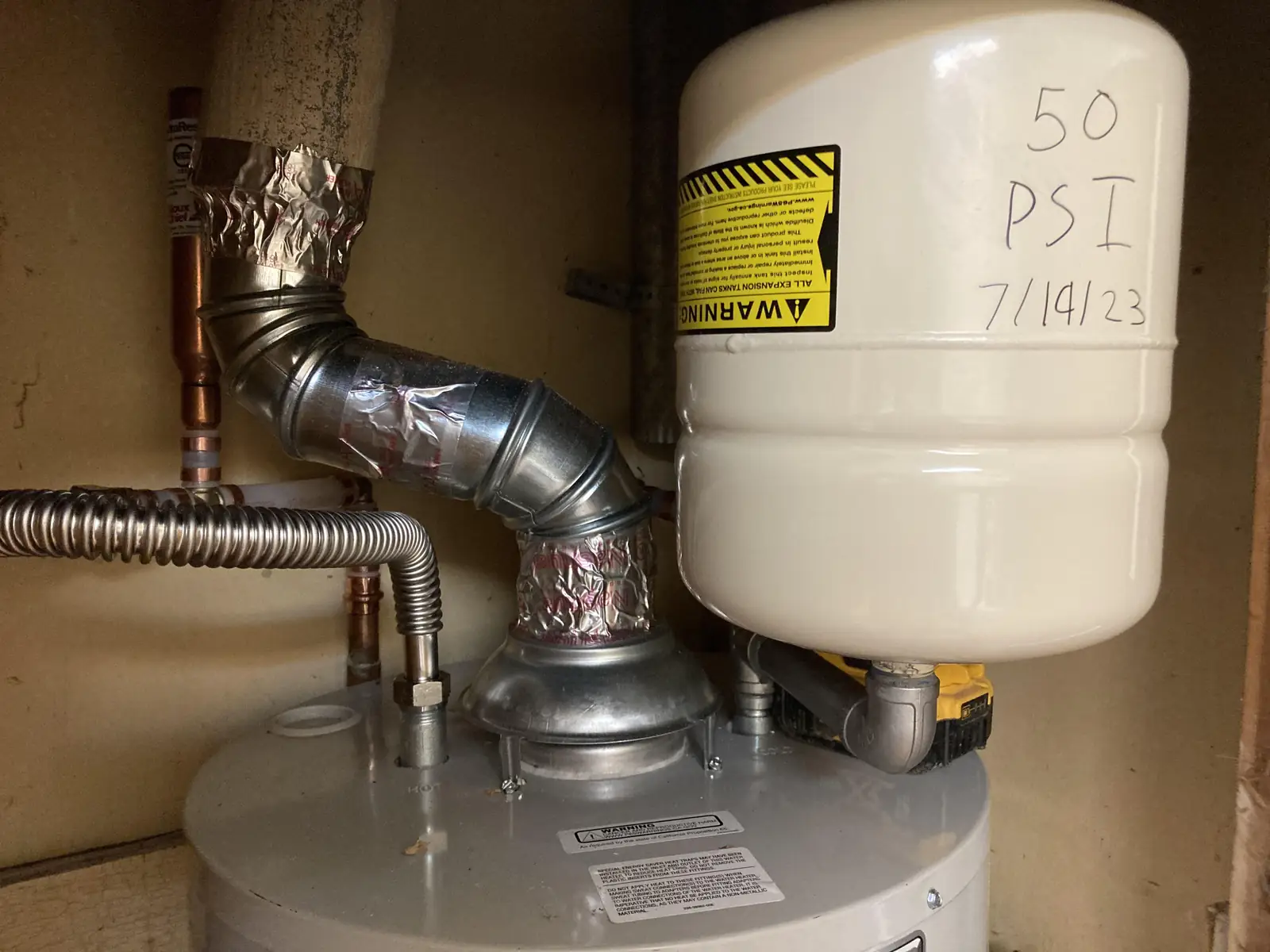 Gas tank water heater with its vent pipe, gas line and expansion tank
