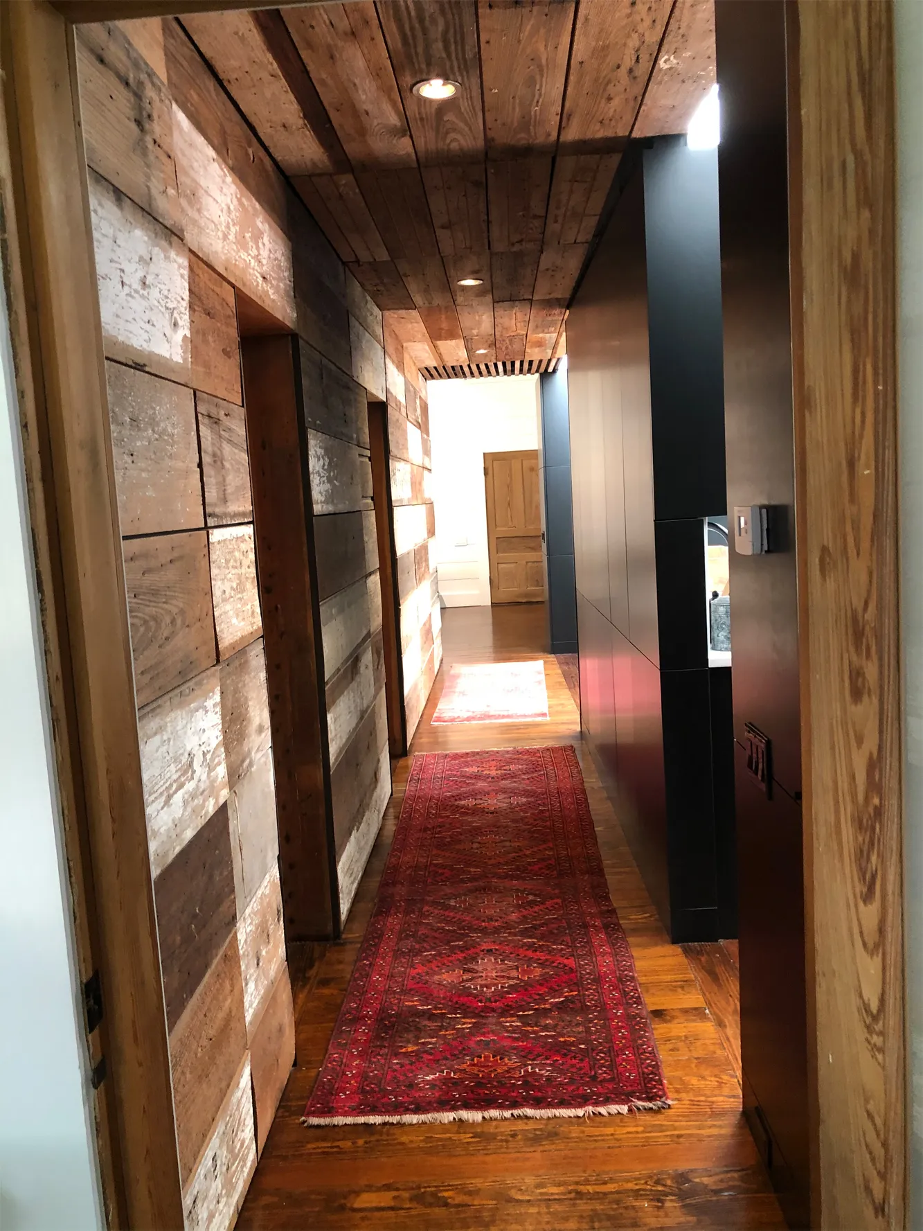 Reclaimed wood hallway in a remodeled home