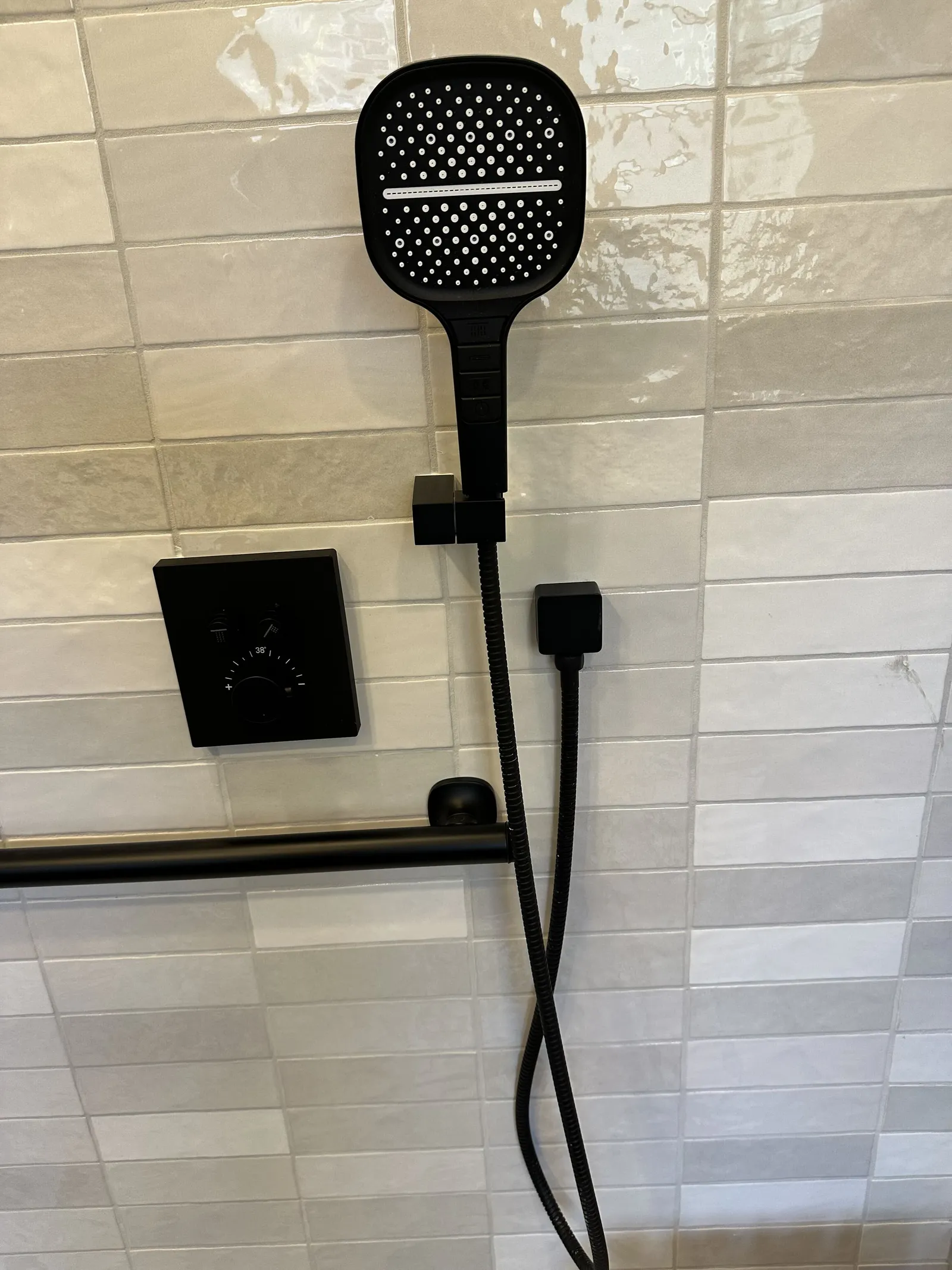 New shower fixtures installed after plumbing work in a Houston bathroom